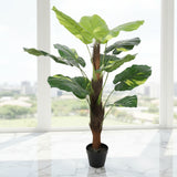 Artificial potted plant with large green leaves on a white background